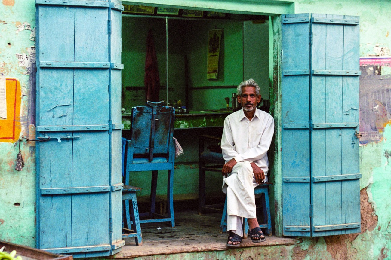 A barber resting between clients, Bikaner, Rajastan, India © 2009 Nick Katin 