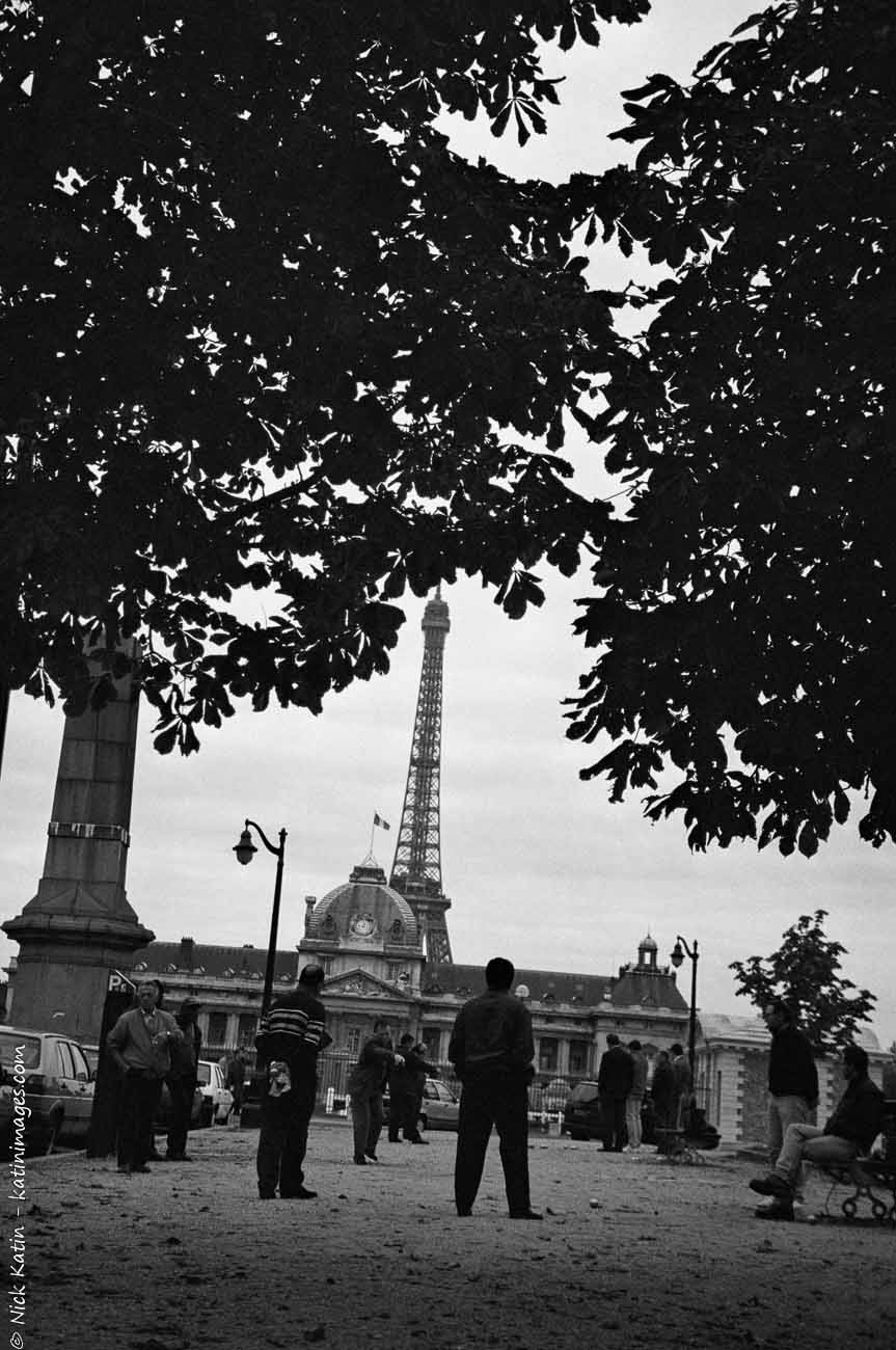 Men playing Pétanque near the Eiffel tower in Paris, France