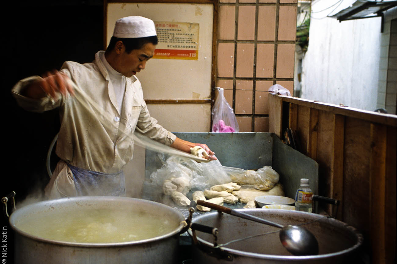 Noodle maker at a small restaurant in the Flowers and Birds Market on Jingxing Street in Kunming capital of the Yunnan province of China.
