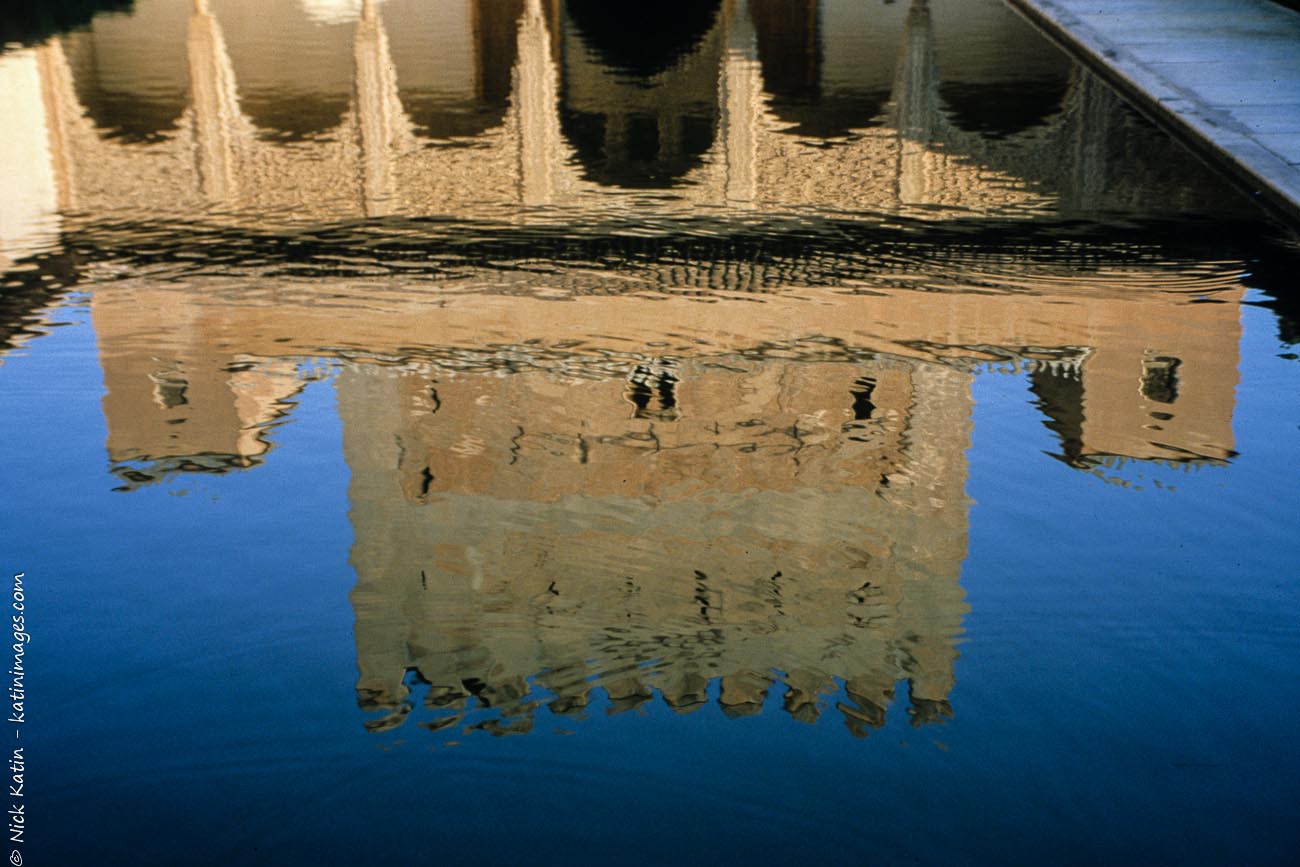 The reflection of one of the beautifully crafted decorated buildings in the 13th century Alhambra Palace in Granada Spain