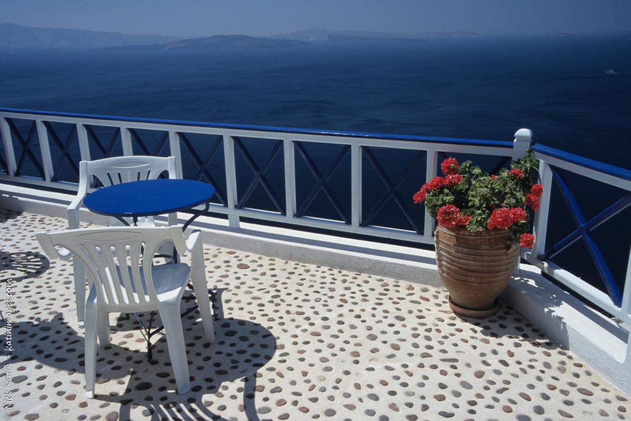 A blacony overlooking the Aegean Sea in Oia Santorini in the Greek Islands