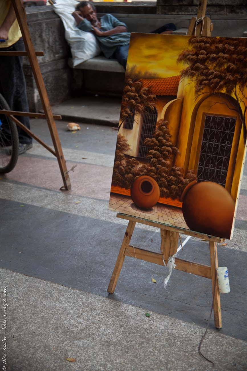 An art vendor asleep on the job in Havana's Prado