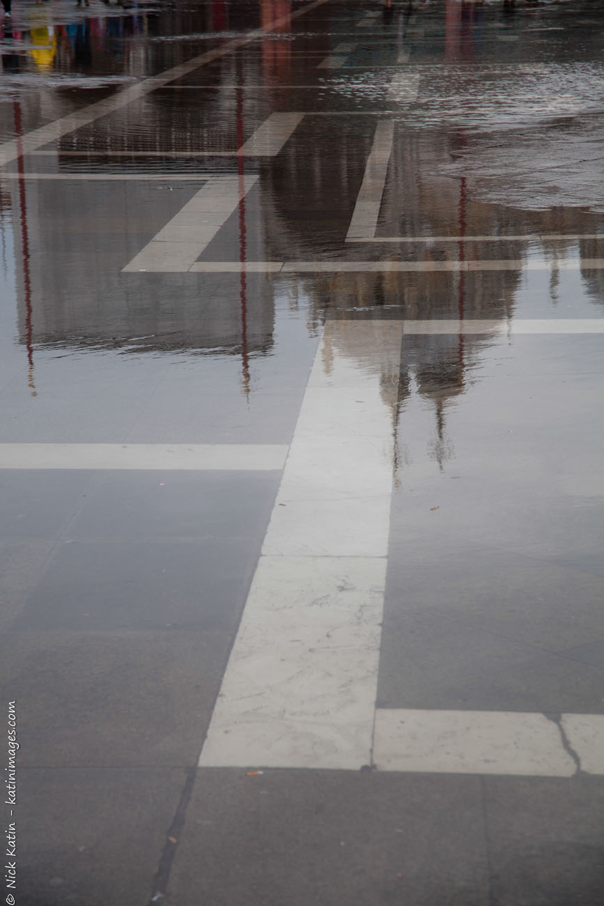 Reflections on a wet Piazza San Marco in Venice, Italy