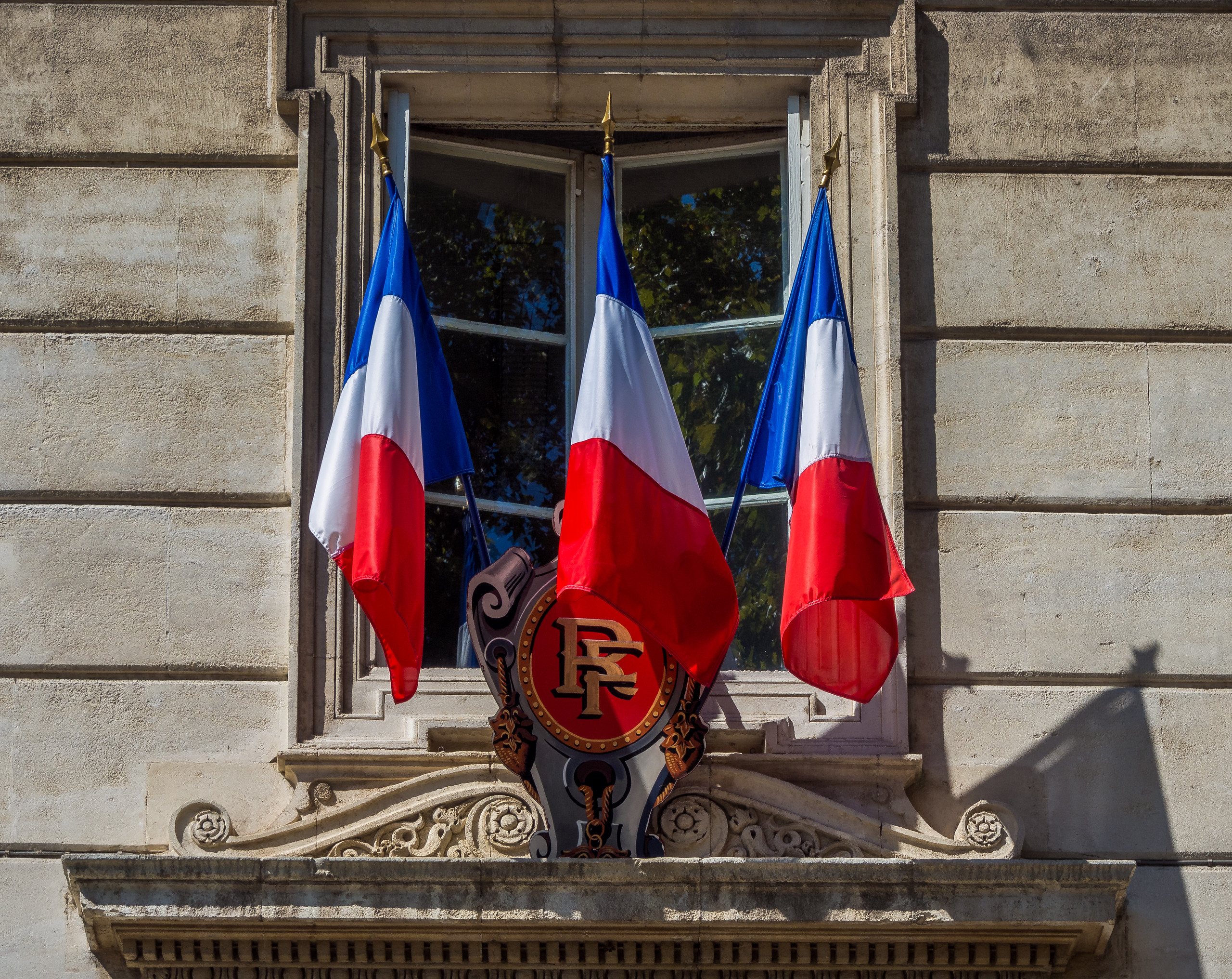 French flags outside the Avignon Town Hall.