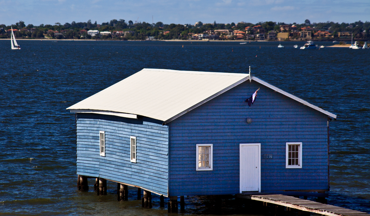 The Crawley Edge Boatshed is a 90 year old blue boathouse at the end of a pier popular with tourists in Crawley, Western Australia
